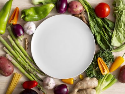 top-view-assortment-veggies-with-empty-plate_23-2148685439